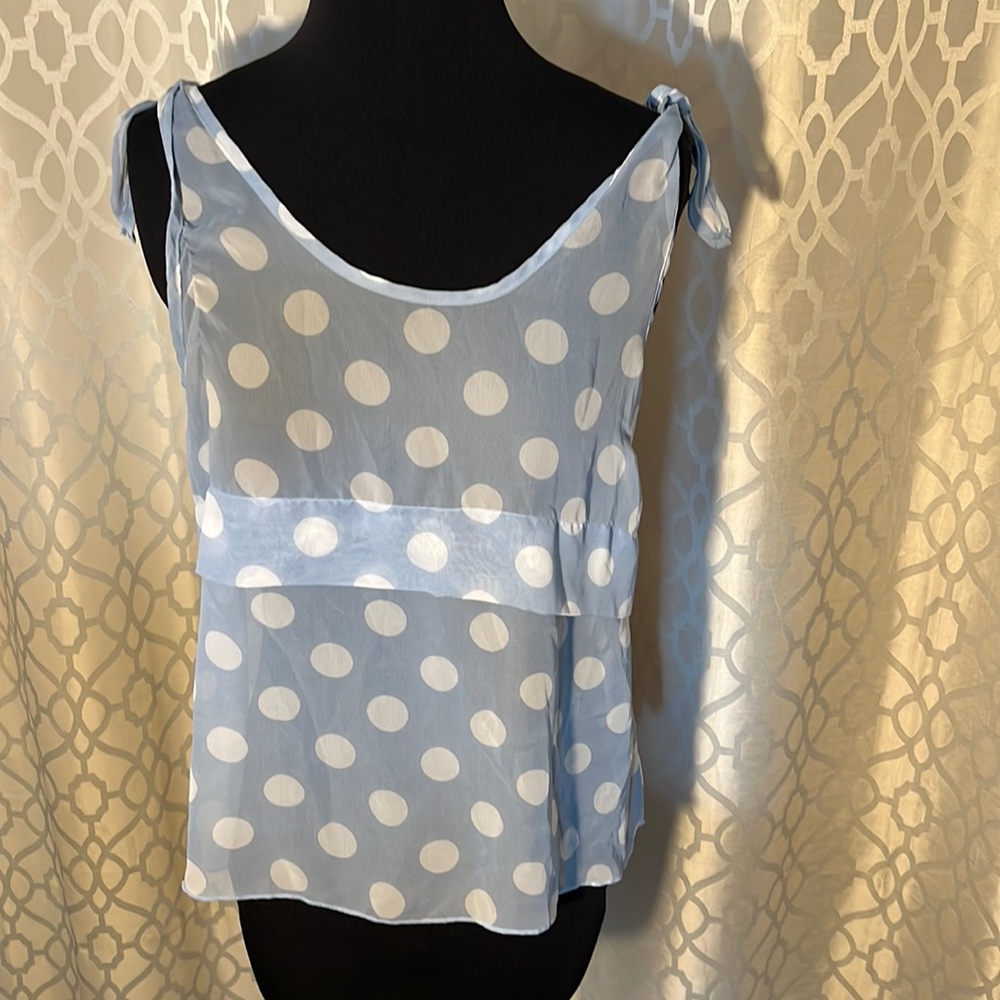 Charlotte Russe size M women’s top. Blue with white spots see through with ties